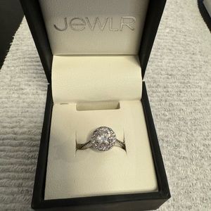 Size 5 halo ring with round cut stone.